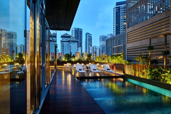 YOTEL Singapore swimming pool evening view